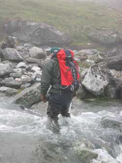 Stream crossing with hip waders